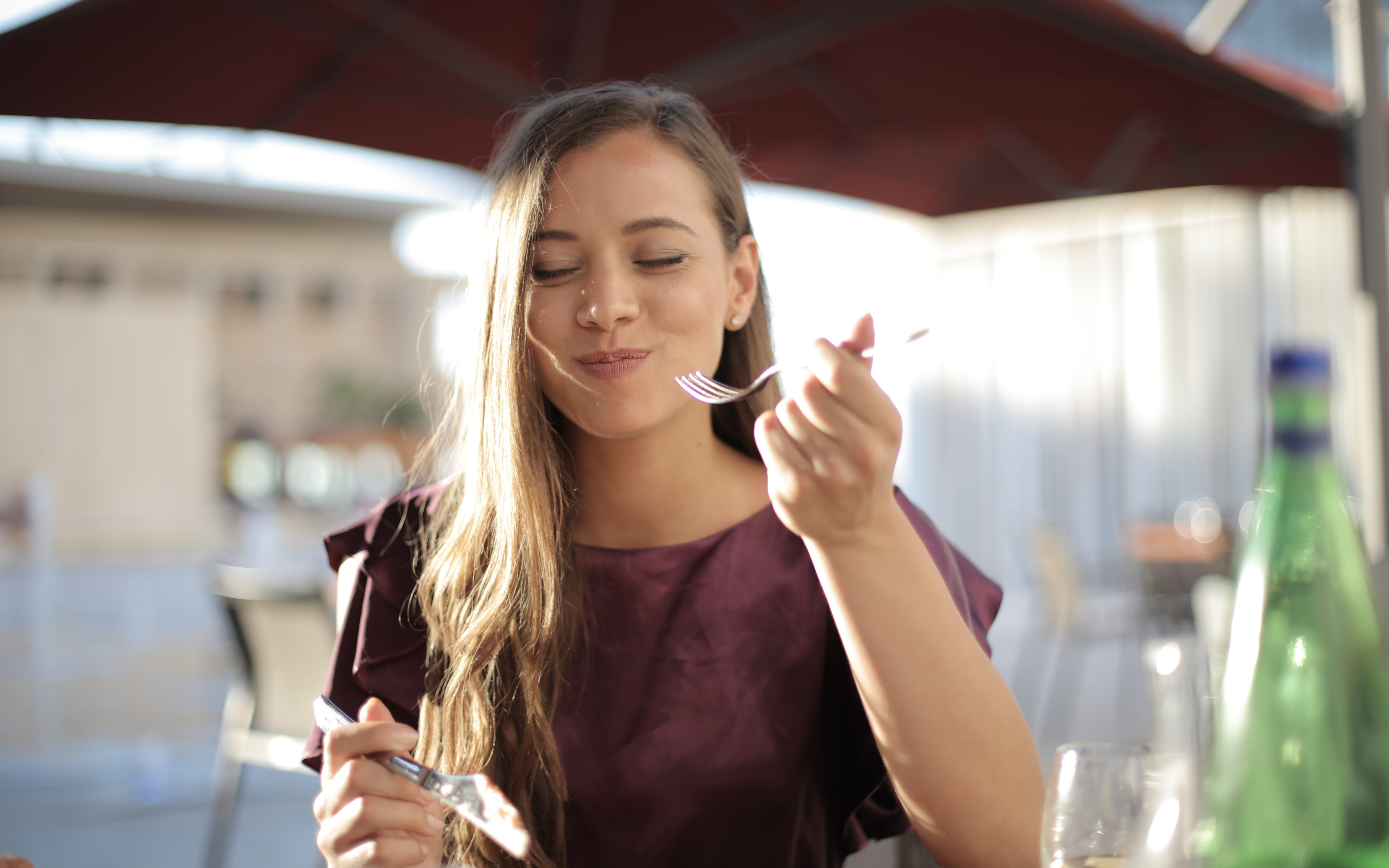 woman looking content while eating